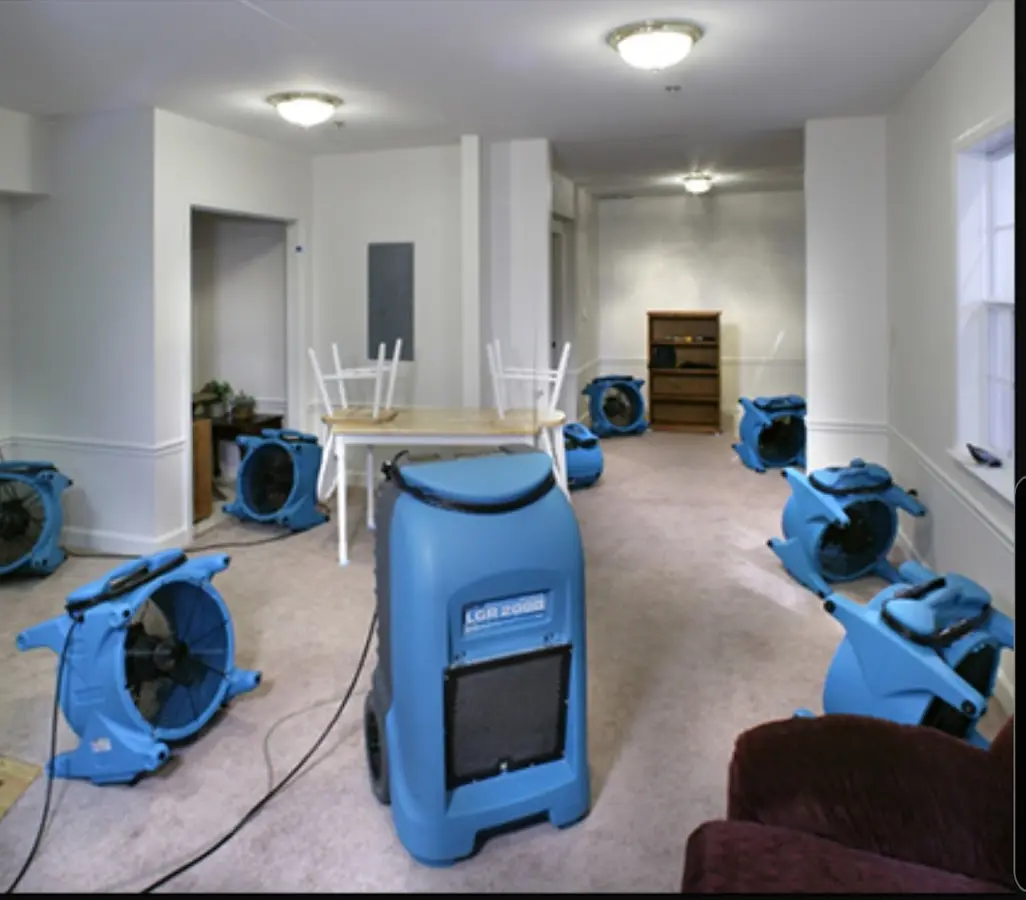 Air movers and dehumidifier setup for Water Damage Restoration in Harrison